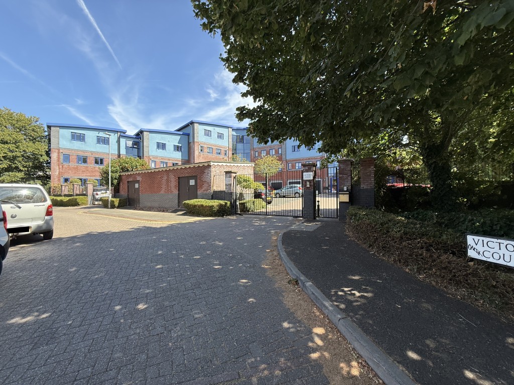 Lot: 187 - GROUND FLOOR APARTMENT IN GATED COMPLEX - Road leading to the complex